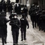 Israeli security forces walk through the streets of Shuafat refugee camp in Jerusalem after the demolition of the family home of Palestinian militant Fadi Abu Shkhaidem, February 1, 2022. Photo: Mahmoud Illean/AP