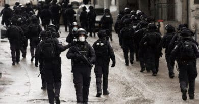 Israeli security forces walk through the streets of Shuafat refugee camp in Jerusalem after the demolition of the family home of Palestinian militant Fadi Abu Shkhaidem, February 1, 2022. Photo: Mahmoud Illean/AP
