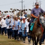 Inmates return from farm work detail at the Louisiana State Penitentiary in Angola, La. Gerald Herbert/AP