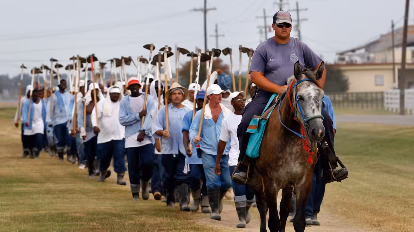 Inmates return from farm work detail at the Louisiana State Penitentiary in Angola, La. Gerald Herbert/AP
