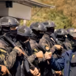 Featured image: Venezuelan minister of interior relations, justice and peace, Remigio Ceballos (right), instructing a group of his officers (left). Photo: REDRADIOVE. 