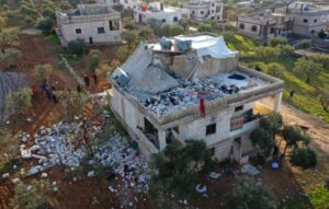 Destroyed building in Idlib, in which alleged ISIS head Abu Ibrahim al-Hashimi al-Qurayshi was killed by US bombers, or he self-detonated, although what seems to have happened is the illegal US forces massacred 14 civilians, mostly women and children. Photo: Sky News