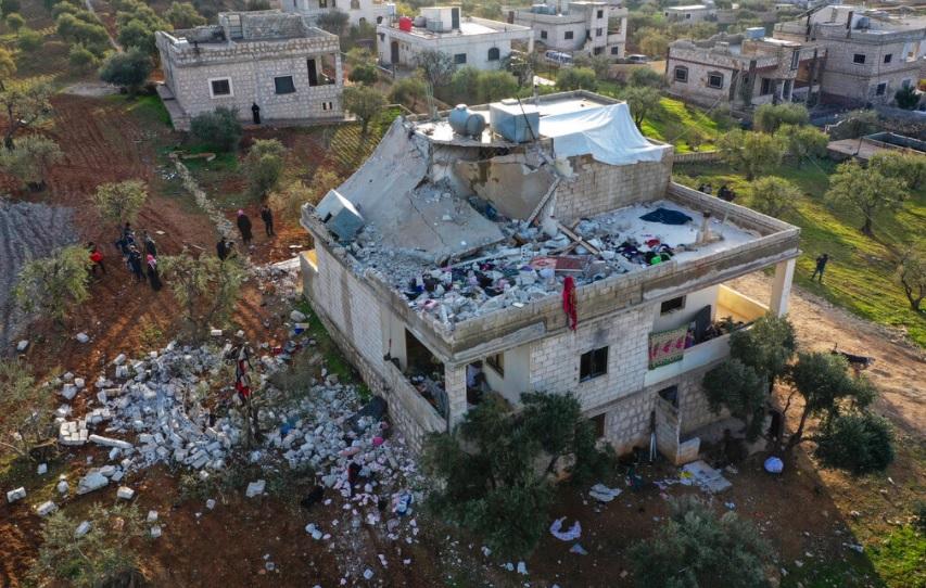 Destroyed building in Idlib, in which alleged ISIS head Abu Ibrahim al-Hashimi al-Qurayshi was killed by US bombers, or he self-detonated, although what seems to have happened is the illegal US forces massacred 14 civilians, mostly women and children. Photo: Sky News