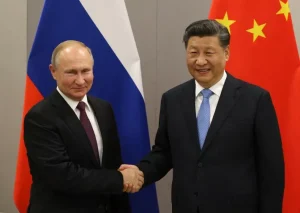 Russian President Vladimir Putin greets Chinese President Xi Jinping during their bilateral meeting on November 13, 2019, in Brasília, Brazil. File photo by Mikhail Svetlov / Getty Images.