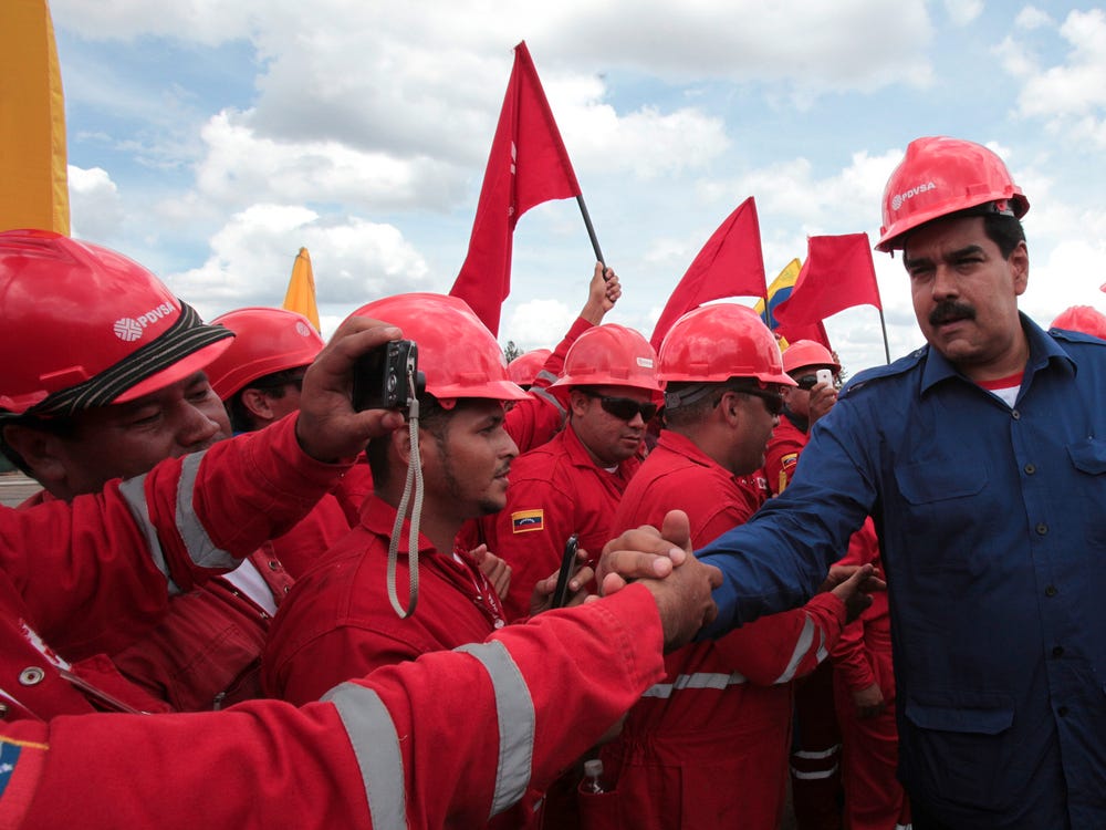 Venezuela's President Nicolas Maduro greets oil workers during a visit to a facility at the oil rich Orinoco belt at the state of Monagas. Photo: REUTERS/Miraflores Palace/Handout.