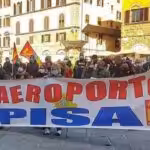 Protesters in Italia holding a banner reading Pisa Airport. File photo.
