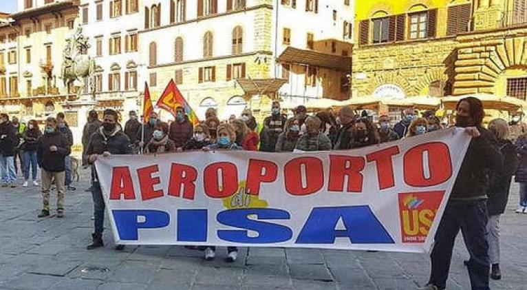 Protesters in Italia holding a banner reading Pisa Airport. File photo.