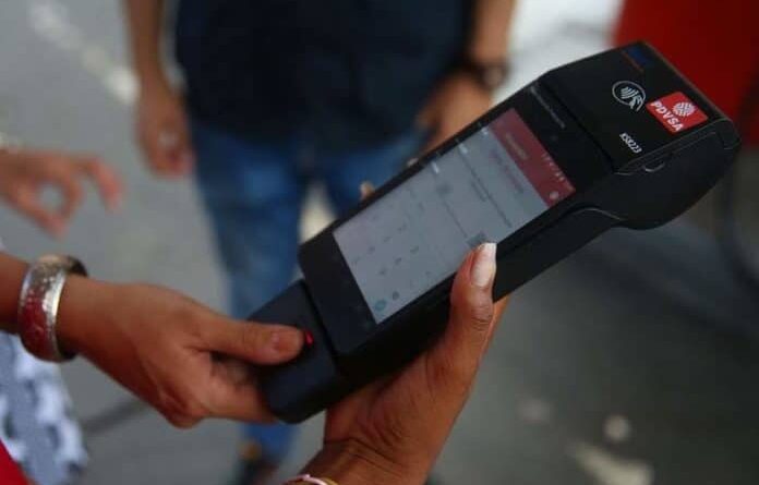 BioPago payment terminal being used to pay and register consume of subsidized gasoline in Venezuela. File photo.
