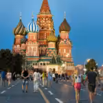 Featured image: People walking in front of the iconic Kremlin, Moscow, in summer. File photo.