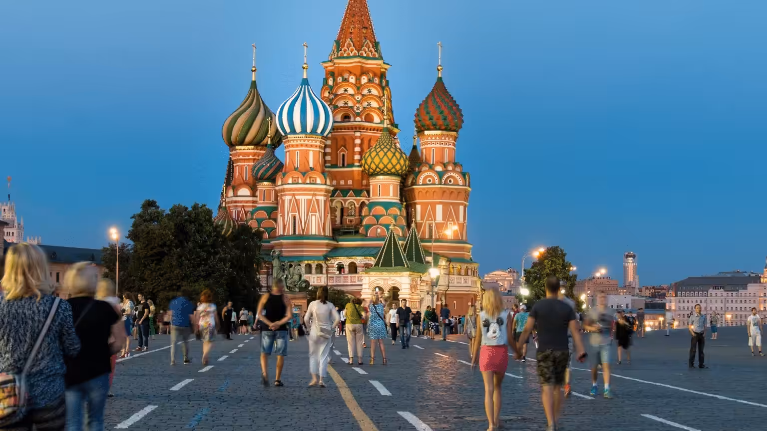 Featured image: People walking in front of the iconic Kremlin, Moscow, in summer. File photo.