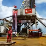 PDVSA oil worker near an oil rig in Venezuela. File photo.