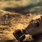 Featured image: A gas mask lies in a desolate and ominous landscape. Photo: RedRadioVe. 