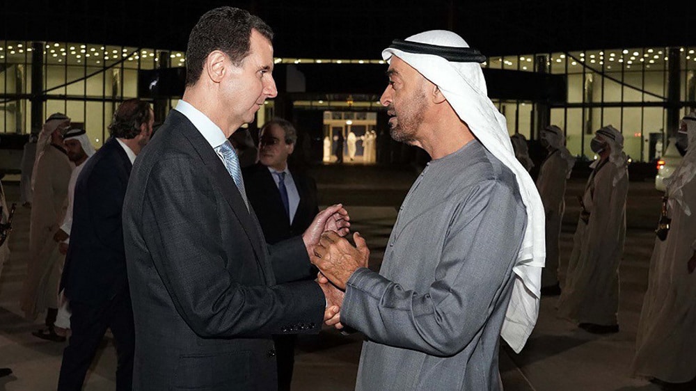 Syria's President Bashar al-Assad (left) being greeted by Abu Dhabi Crown Prince Mohammed bin Zayed Al Nahyan (right), in Abu Dhabi, March 18, 2022. Photo: Syrian Presidency handout