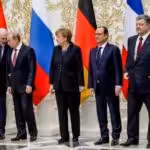 From left to right: Belarusian President Alexander Lukashenko, Russian President Vladimir Putin, German Chancellor Angela Merkel, French President François Hollande, and Ukrainian President Petro Poroshenko pose during a meeting aimed at halting the war in Ukraine, at the presidential residence in Minsk, Belarus, on February 11, 2015. Photo: Maxim Malinovsky/AFP/Getty Images.