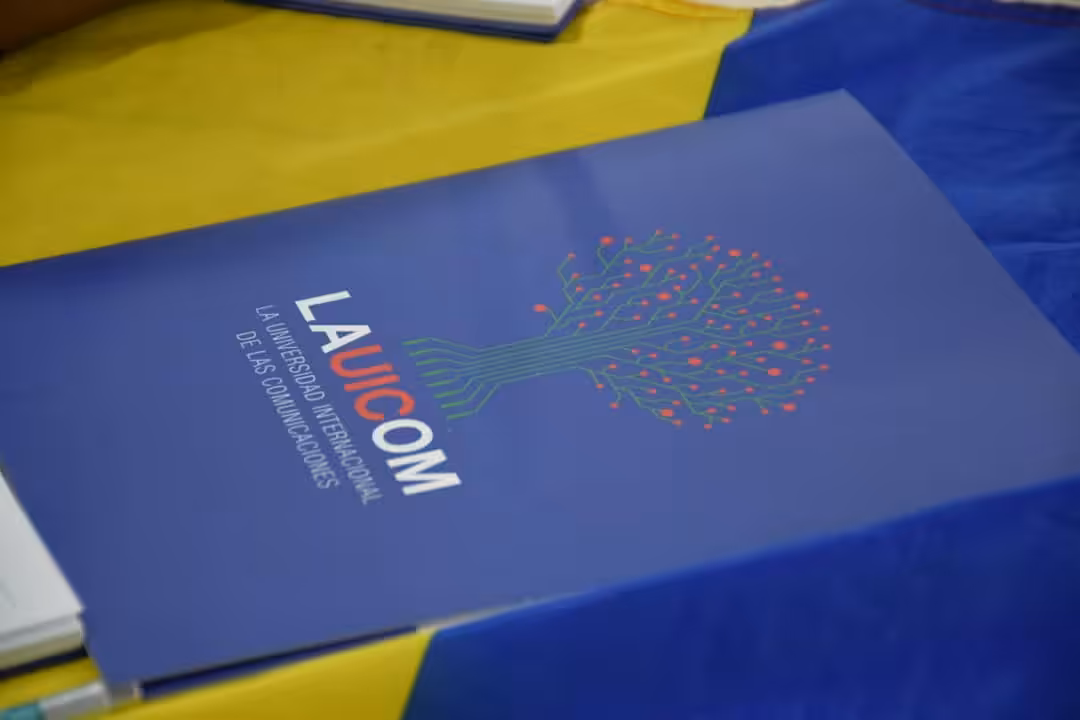 Booklet with the caption on the front page: UICOM, the International University for Communications. File photo.