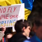 a-protester-holds-up-a-sign-calling-for-nato-to-create-a-no-fly-zone-over-ukraine
