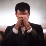 Former deputy Juan Guaido in a praying photo pose. File photo.