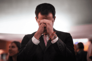 Former deputy Juan Guaido in a praying photo pose. File photo.
