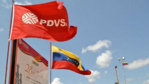 PDVSA flag nets to Venezuelan flag near a PDVSA facility. File photo.