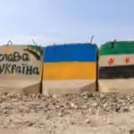 ukraine-syria-white-helmets-rocks-flags-2000x900