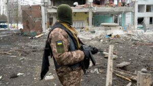 Ukraine Soldier looking at the war destruction. File photo.