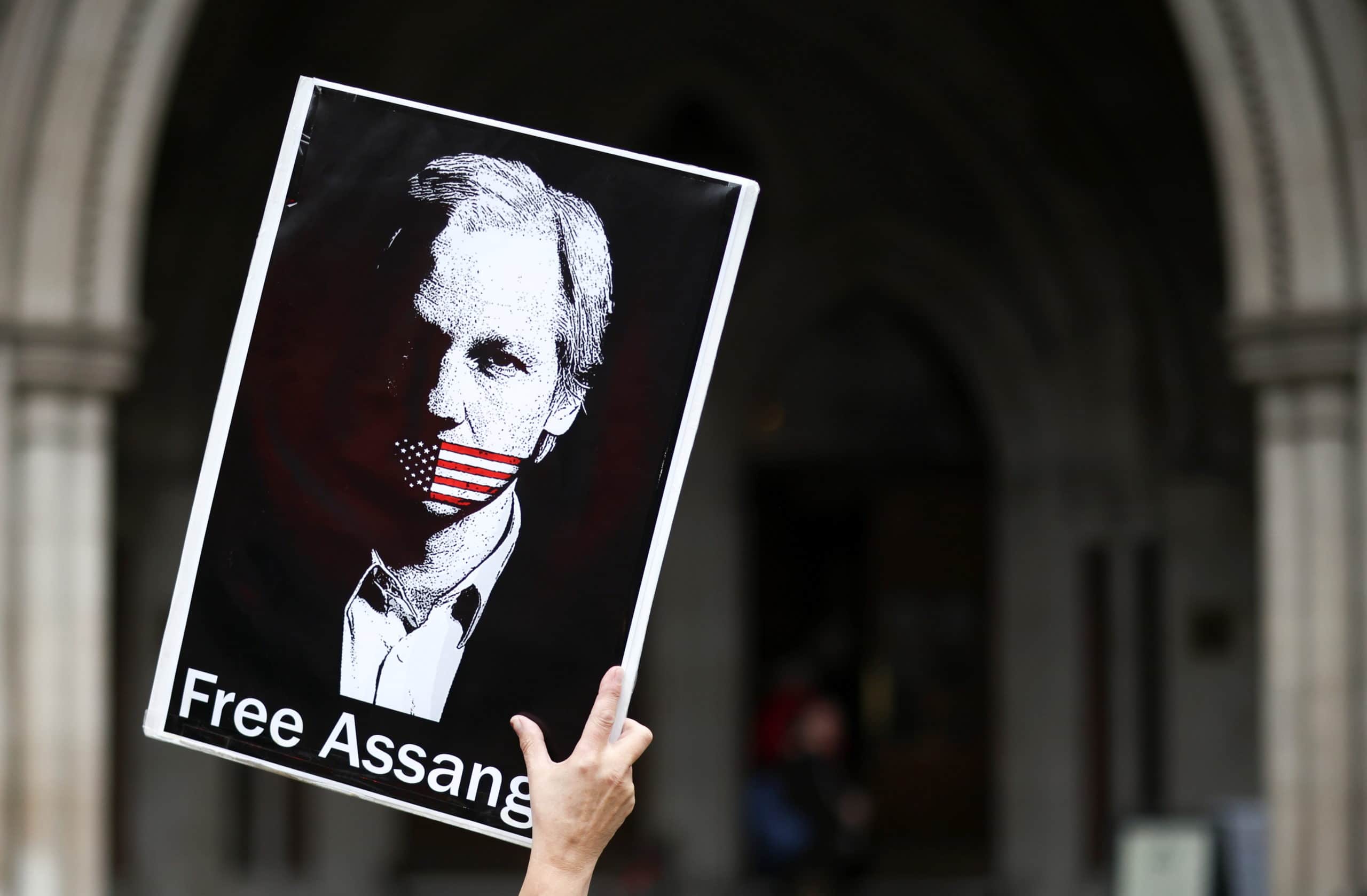 A supporter of Wikileaks founder Julian Assange protests outside the Royal Courts of Justice in London, Britain, October 27, 2021. Photo: Reuters/Henry Nicholls.