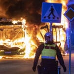 A policeman during riots in the city of Malmo, Sweden, on April 16, 2022. Photo: Johan Nilsson/TT News Agency/AFP.