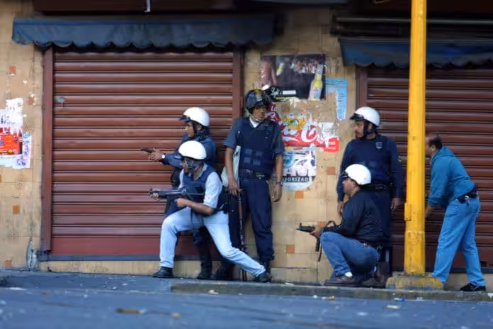 Policemen from the Metropolitan Police (involved in the Coup) shooting at the pro-Chavista demonstrators concentrated at the Puente Llaguno bridge, Caracas. File photo.