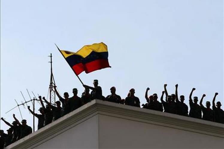 Presidential Guard in Miraflores Palace after retaking control of the headquarters of the government in the afternoon of Saturday, April 13, 2002. File photo.
