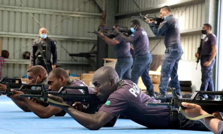 China police liaison team officers train local Solomon Islands police officers in drill. Photograph: RSIPF/AFP/Getty Images