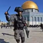Israeli occupation forces assault Palestinians at Jerusalem's Al-Aqsa mosque compound, April 15, 2022 | Photo: Twitter/ @kenyan_digest.