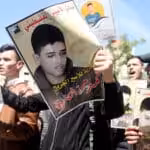 There have been demonstrations across the West Bank in support of Ahmad Manasra as he is due in court to secure an appeal against his sentence, here outside the Red Ross/Red Crescent offices in Hebron. (Samar Bader APA images).