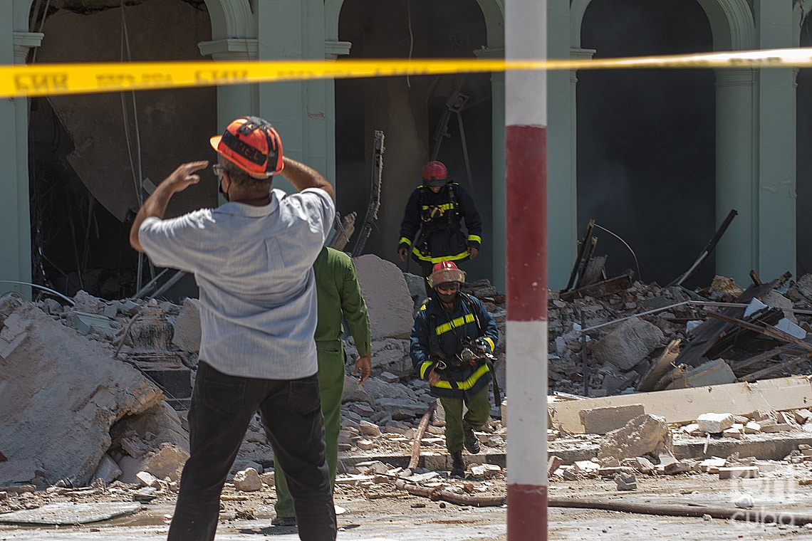 Firefighters at work at the site of the explosion. Photo: OnCuba News