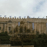 Featured image: Jewish settlers raised the Israeli flag atop the Ibrahimi Mosque in Hebron. Photo: via Palinfo.