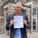 Featured image: Environmental lawyer Steven Donziger shows his release papers on April 25, 2022, in New York City. Photo: Twitter/@SDonziger
