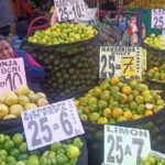 Featured image: Lady selling in a popular market. Photo: Kawsachun News.