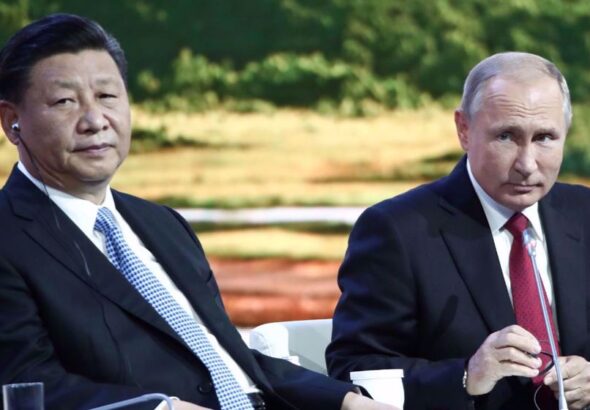 Russian President Vladimir Putin right) and his Chinese counterpart, Xi Jinping. Reuters photo.