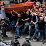 Israeli police attack funeral procession of slain Palestinian journalist Shireen Abu Akleh in Jerusalem. Photo: AP.