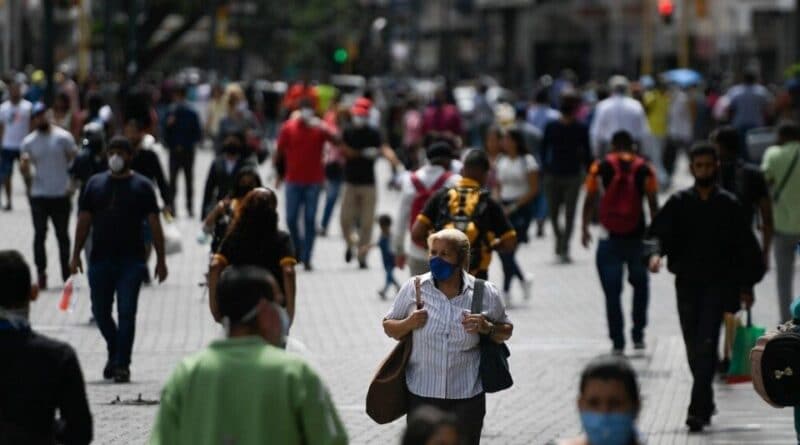Busy street in Caracas, Venezuela with most people wearing face masks. File photo.