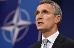 NATO's general secretary, Jens Stoltenberg, with the military organization logo in the background. Photo: AFP.