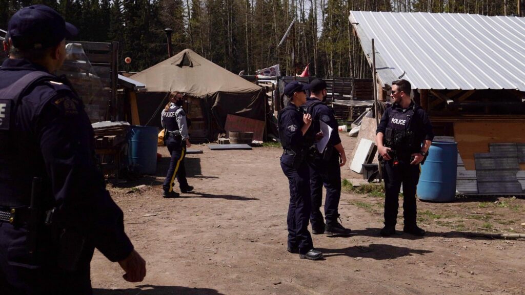 RCMP conducting a “site inspection” of a Wet’suwet’en village site. Gidimt’en Checkpoint.