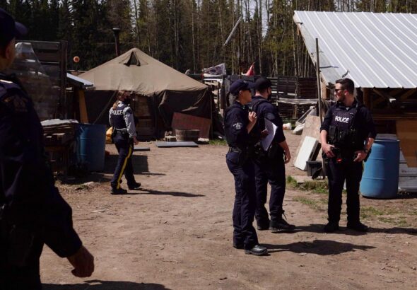 RCMP conducting a “site inspection” of a Wet’suwet’en village site. Gidimt’en Checkpoint.