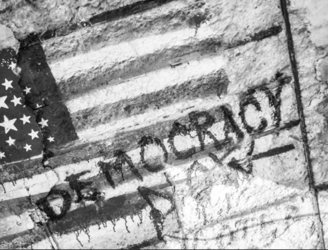 United States flag with the word democracy written on it. File photo.