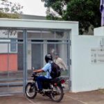A motorcyclist waits at the entrance of Nicaragua's Language Academy. Photo: AFP/Getty images.