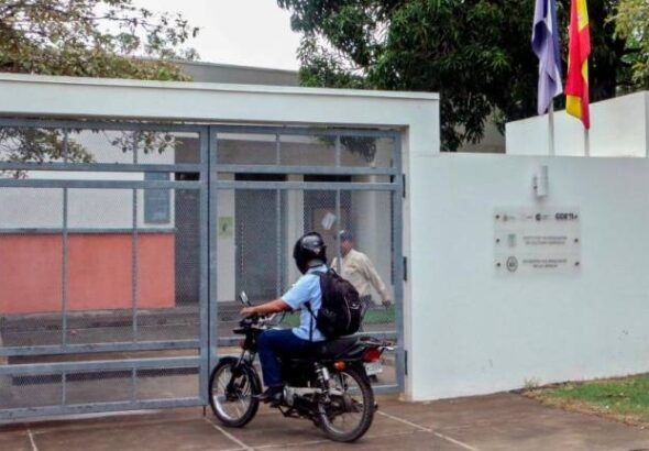 A motorcyclist waits at the entrance of Nicaragua's Language Academy. Photo: AFP/Getty images.