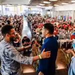 Organizers of the People's Summit welcome Bolivian Senate President Andrónico Rodríguez (center) to inaugurate the event. Photo: Twitter/@PeoplesSummit22.