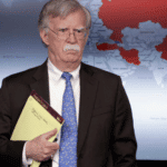 John Bolton standing in front of a map of global support for Guaidó vs Maduro. Photo: RedRadioVE.