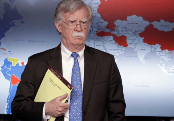 John Bolton standing in front of a map of global support for Guaidó vs Maduro. Photo: RedRadioVE.