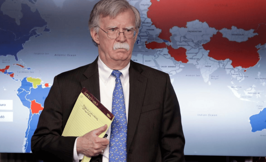John Bolton standing in front of a map of global support for Guaidó vs Maduro. Photo: RedRadioVE.