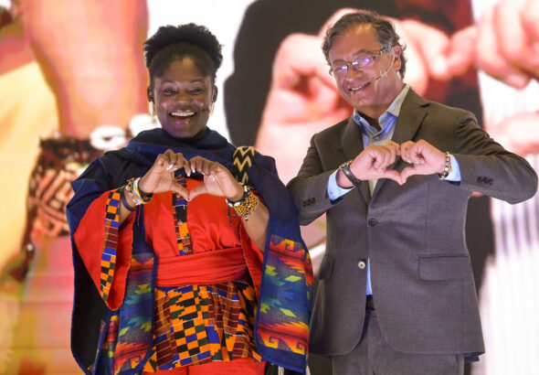 Now Vice President elected Francia Márquez (left) and President elected Gustavo Petro (right) doing the love hand sign in a public event. File photo: Colprensa.